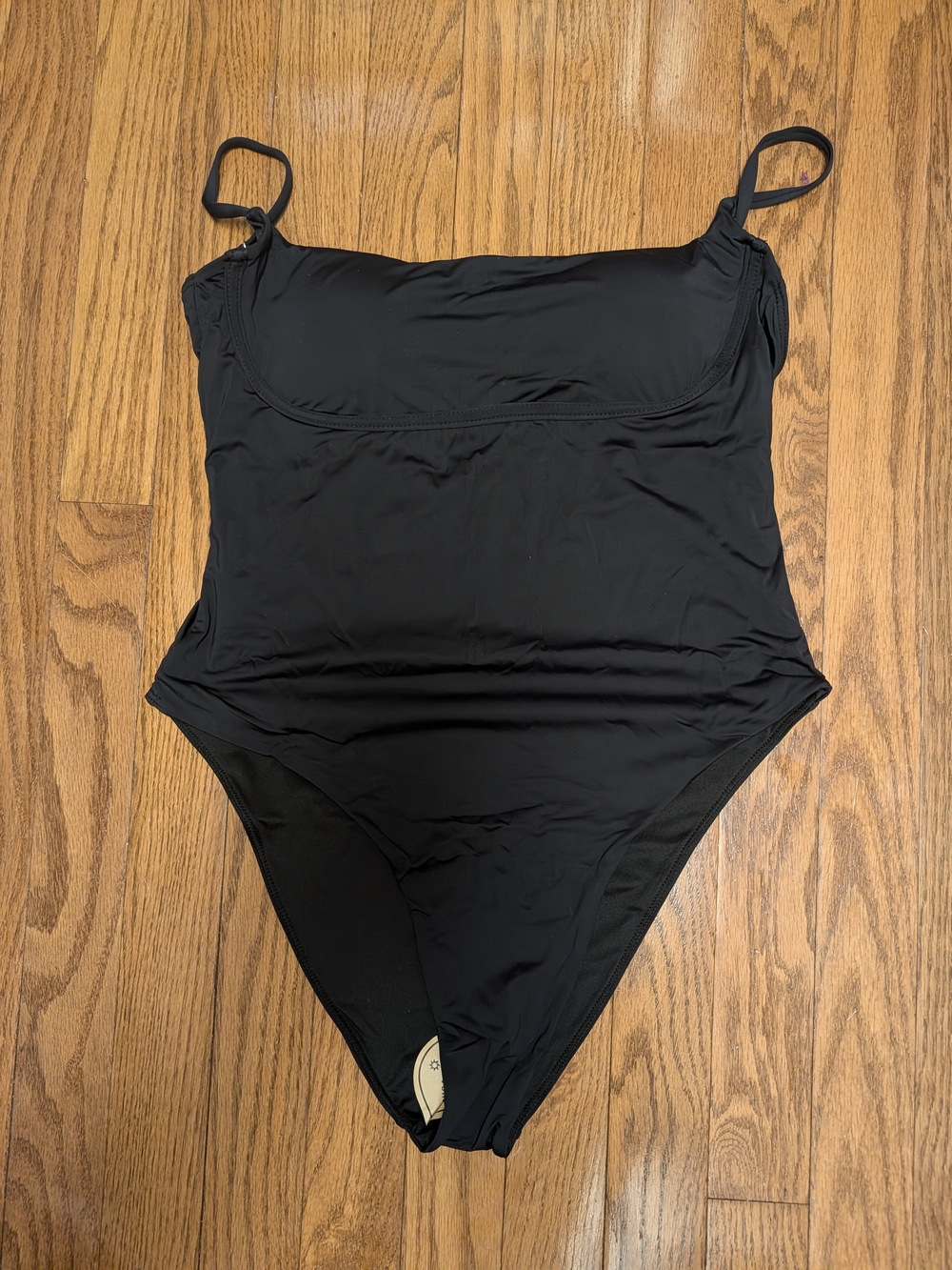 Sleek Black One-Piece Swimsuit with Adjustable Straps